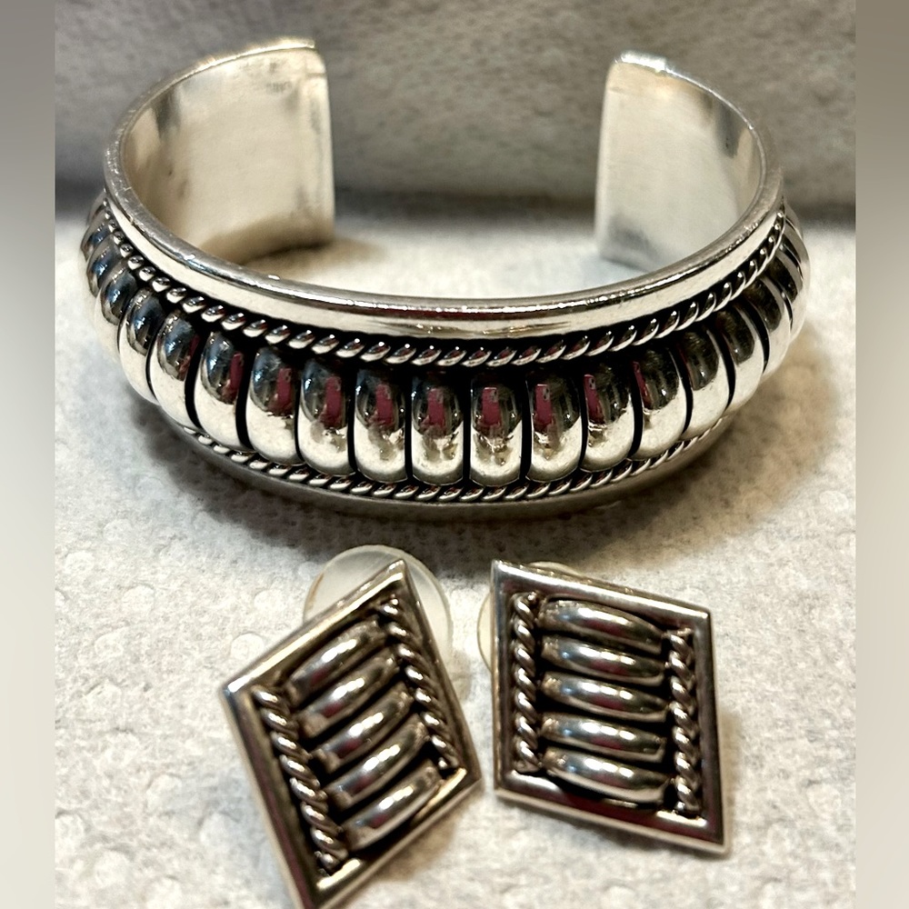 Sterling (925) silver cuff bracelet and matching earrings.